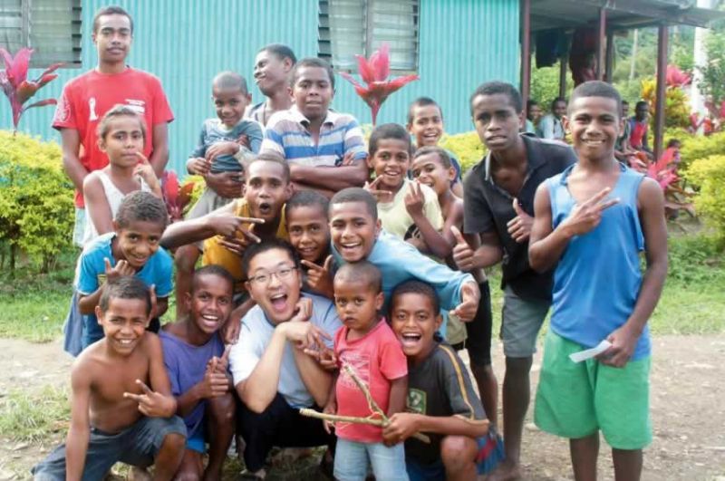 Andrew with new friends at Namosi village.