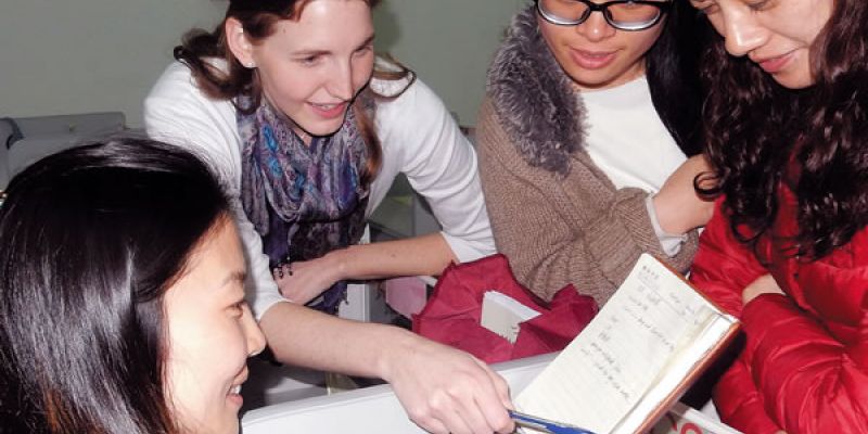 An AITECE volunteer and her students