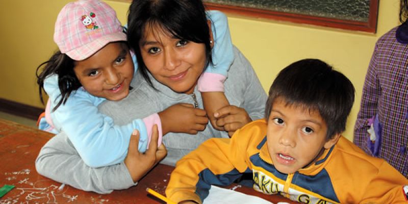 A volunteer works with children and the center