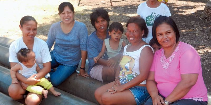 Columban Lay Missionary Ana Flores Huanam and viliagers